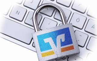 Vorhängeschloss mit Volksbank Logo auf Computer Tastatur